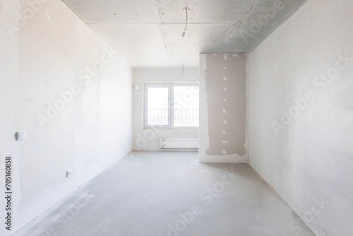 interior of the apartment without decoration in gray colors. rough finish