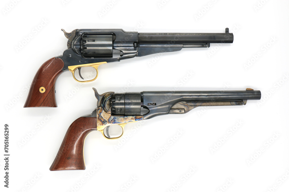 Two most famous black powder revolvers Colt 1860 Army and Remington 1858 New Army on a white background. Comparision, right side. Two most famous black powder revolvers Colt 1860 Army and Remington 1858 New Army on a white background. Comparision, right side.