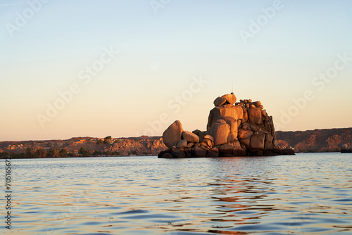 Rocky island seen from inside the Philae temple located in the city of Aswan, Egypt. photo