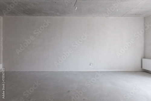 interior of the apartment without decoration in gray colors. rough finish