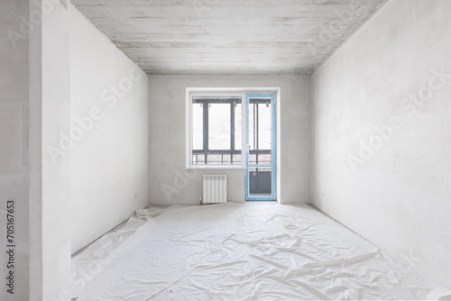 interior of the apartment without decoration in gray colors. rough finish