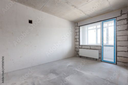 interior of the apartment without decoration in gray colors. rough finish