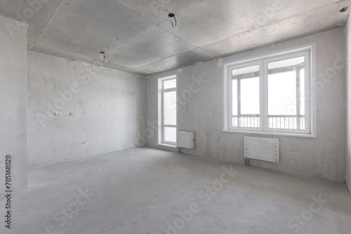 interior of the apartment without decoration in gray colors. rough finish