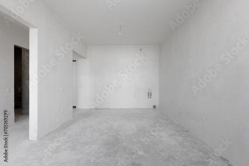 interior of the apartment without decoration in gray colors. rough finish