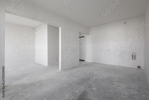 interior of the apartment without decoration in gray colors. rough finish