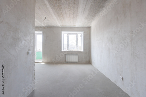 interior of the apartment without decoration in gray colors. rough finish