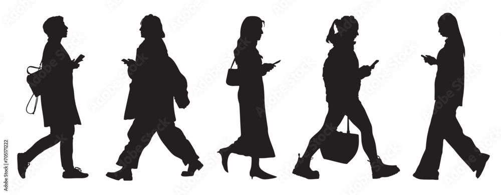 Black silhouettes of 5 walking women with phones isolated on white background. Side view. Vector illustration Black silhouettes of 5 walking women with phones isolated on white background. Side view. Vector illustration