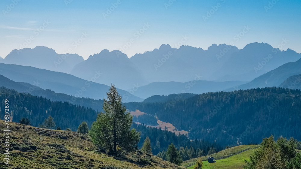 Fototapeta premium Panoramic view of Silhouettes of massive mountain ridges of majestic untamed Sexten Dolomites in South Tyrol, Italy, Europe. Hiking concept Italian Alps. Lift in Tre Cime (Drei Zinnen) national park