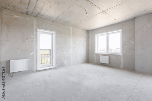 interior of the apartment without decoration in gray colors. rough finish
