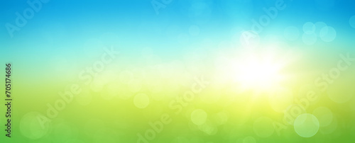 Fresh spring abstract background with bokeh and sun glow. Graphic element with blue and green horizontal colour gradients.