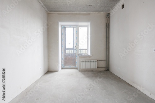 interior of the apartment without decoration in gray colors. rough finish