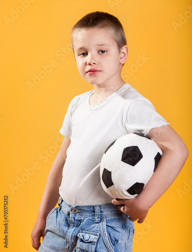 Portrait of a little football fan boy © Dasha Petrenko