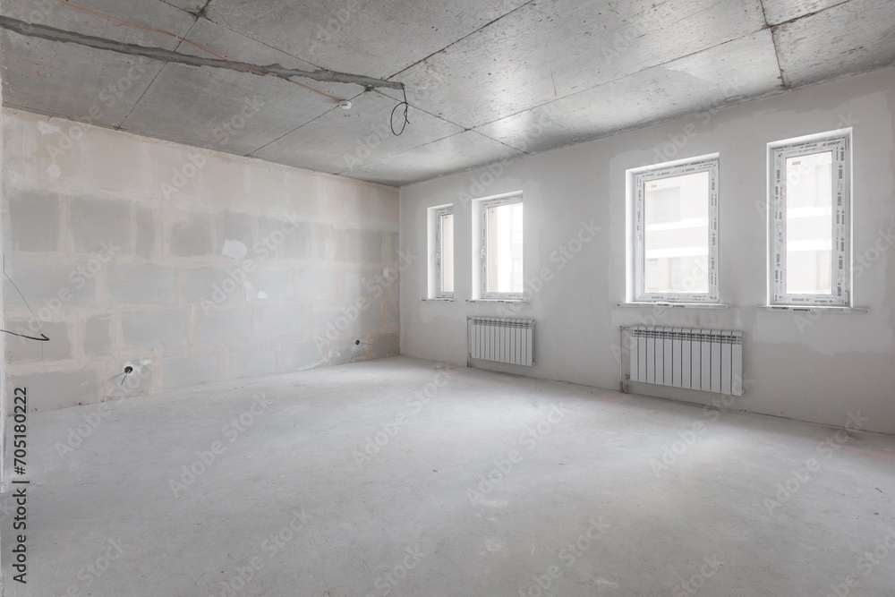 interior of the apartment without decoration in gray colors. rough finish interior of the apartment without decoration in gray colors. rough finish