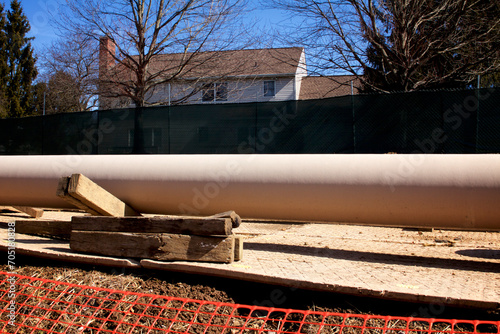 Natural gas liquids pipeline construction in a residential neighborhood using horizontal directional drilling. photo