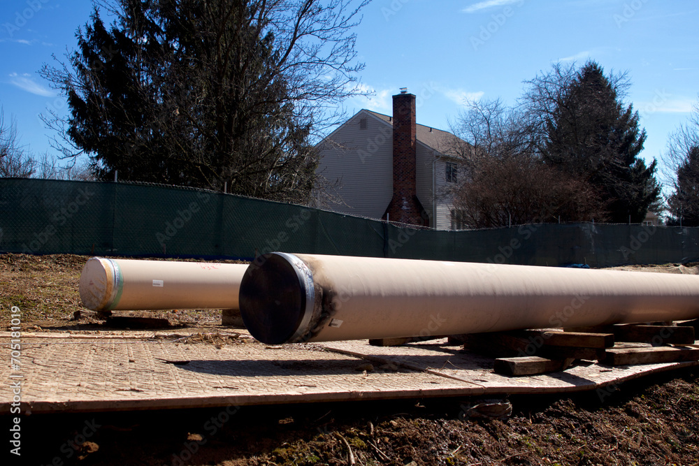 Natural gas liquids pipeline construction in a residential neighborhood using horizontal directional drilling.