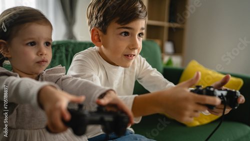 brother and sister siblings boy and girl play video game console