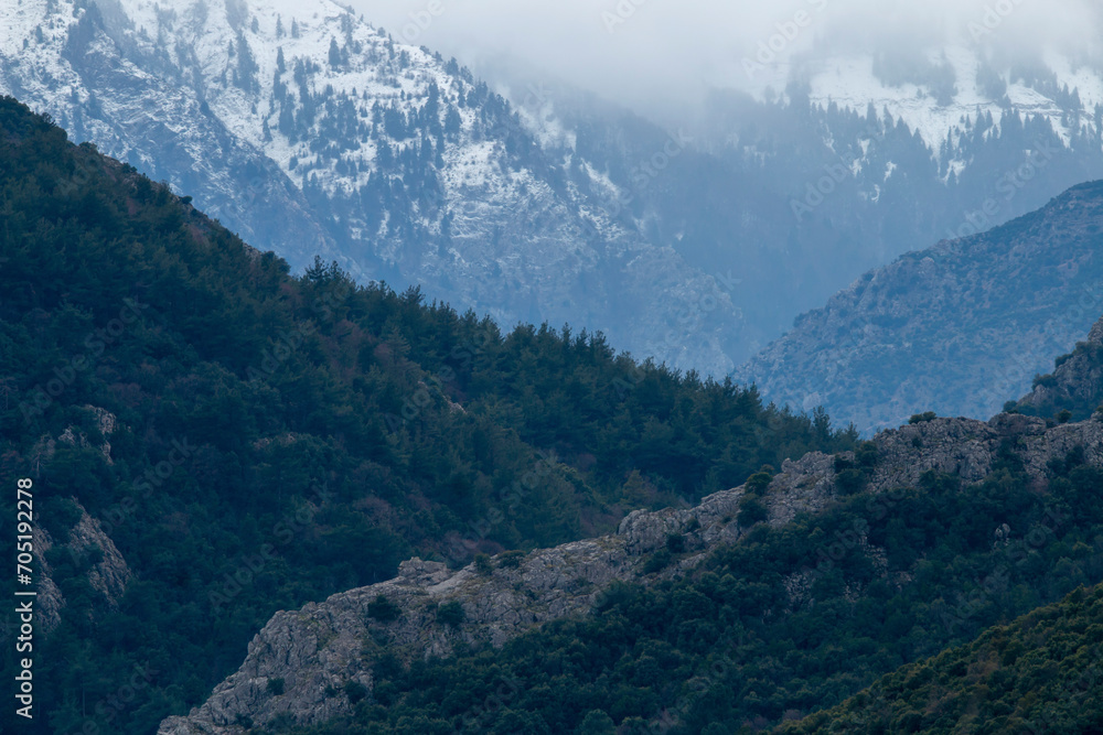 Fototapeta premium Pindus mountains in Greece with snow and fog. Beautiful destination for travel.