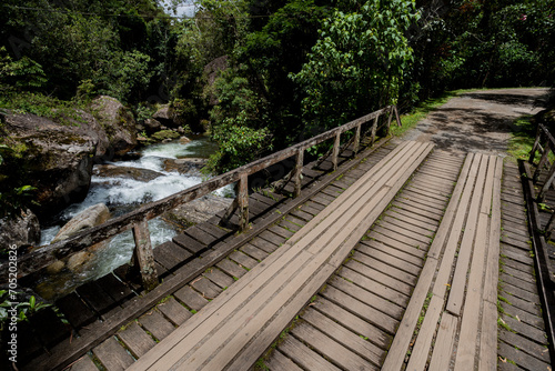 Ponte de madeira sobre as corredeiras do Rio Preto, Visconde de Mauá, Rio de Janeiro, Brasil photo