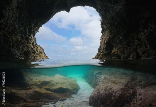 View from a sea cave on the Atlantic coast of Spain, split level view over and under water surface, natural scene, Galicia, Rias Baixas photo