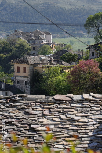 View over the stone covered roofs of Ottoman-era houses to Arshi Lengo village, Lunxheri mountain foot. Gjirokaster-Albania-215 photo