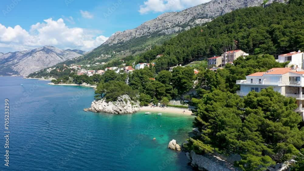 Beautiful Brela on Makarska riviera, Croatia. Adriatic Sea with amazing turquoise clean water and white sand. Aerial view of Brela beach and waterfront on Makarska riviera, Dalmatia region of Croatia. Beautiful Brela on Makarska riviera, Croatia. Adriatic Sea with amazing turquoise clean water and white sand. Aerial view of Brela beach and waterfront on Makarska riviera, Dalmatia region of Croatia.