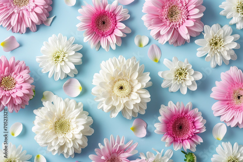 A bunch of pink and white flowers on a blue background created with generative AI technology photo