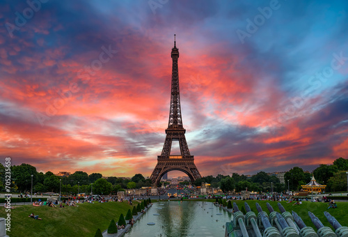 View of Eiffel Tower from Jardins du Trocadero in Paris, France. Eiffel Tower is one of the most iconic landmarks of Paris. Sunset cityscape of Paris
