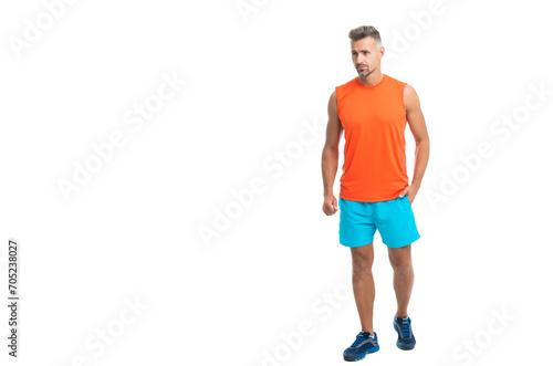 sporty athletic man in tshirt isolated on white copy space banner. A standing athletic man at the gym studio. athletic man during a yoga class. athletic man posed before a fitness competition © be free