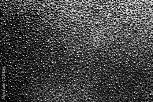 Obraz na płótnie Water drops background. Wet glass surface texture. Winter window condensation problem. Bubble dew pattern. Transparent window blue raindrops. Humidity condensation texture. Black water background.