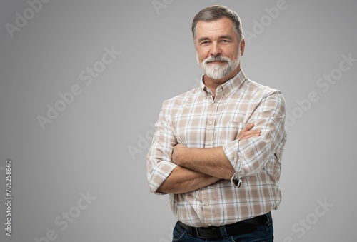 Portrait of happy casual mature man smiling, senior age man with gray hair, Isolated on gray background photo