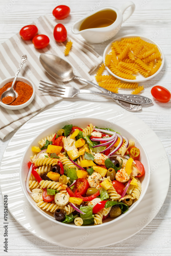 fusilli salad with mozzarella, veggies in a bowl