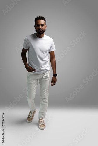 Handsome young african american guy posing in studio - isolated