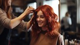 A redhead woman is being made into a hairstyle by a female hairdresser at a beauty salon.