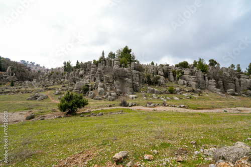 Majestic view of valley with beautiful rock formations on a autumn day. Adamkayalar, Selge, Manavgat, Antalya, Turkey. photo