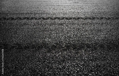 Close Up Asphalt Road Highway. Black Car Rubber Tire Brake Track Mark.