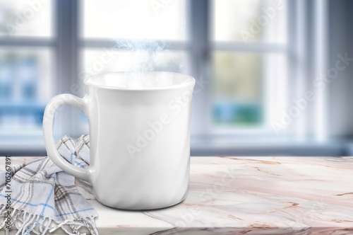 A cup of tasty hot tea on the windowsill