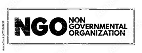 NGO - Non-Governmental Organization is an organization that generally is formed independent from government, acronym text concept stamp photo