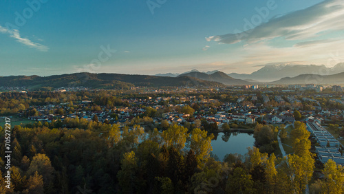 Early morning panorama of Koseze pond or koseski bajer with a modern city hlock on the right. Picturesque morning of siska, a ljubljana suburb. Sun just rising up. photo