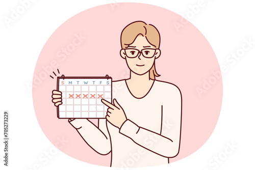 Young woman points finger at calendar with marks recommending time management or paying attention to date. Girl secretary in glasses announces important upcoming event. Flat vector illustration