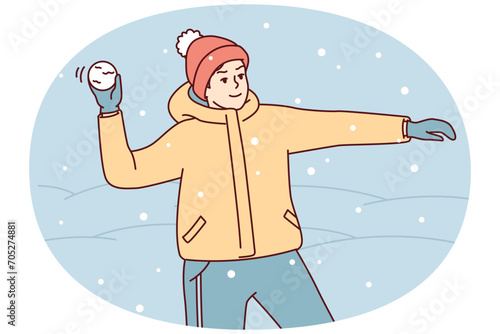 Teenage boy in winter clothes and hat plays snowballs throws snow at friends. Youth guy stands on street among snowdrifts enjoys cold weather and frolic during holidays. Flat vector illustration