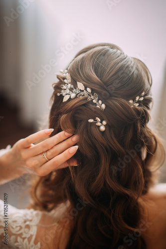 The image is of a woman getting her hair done, possibly for a wedding, as indicated by the tags bride and wedding