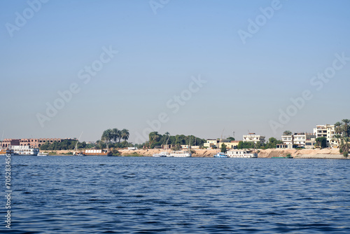 Sunset, Sand dunes on the Coastline of the Nile river part called First Cataract, Aswan, Egypt. River Nile in Egypt. Luxor, Africa.