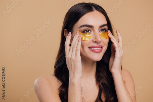 Canvastavla Woman standing naked isolated looking camera take care of her skin with under ey