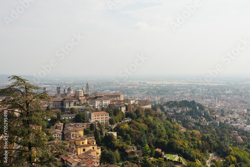 View at Old Town Citta Alta of Bergamo from San Vigilio Hill. Bergamo, Italy. Travel postcard © mdyn