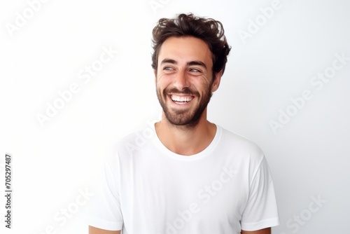 Portrait of happy young man smiling and looking at camera isolated on white background