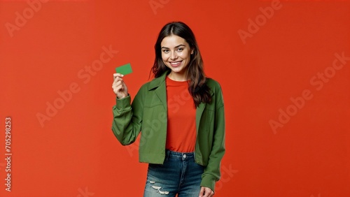 Smiling woman holding a card, with colorful background.