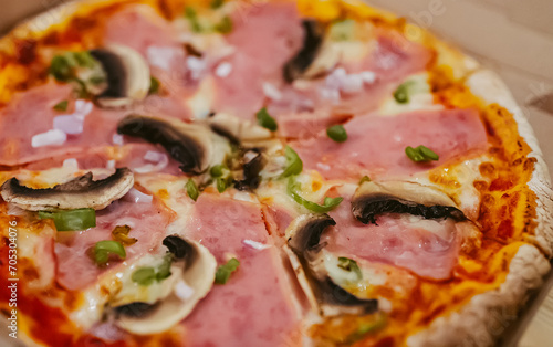 Pizza Mortadella with Champignons on yeast-free dough.