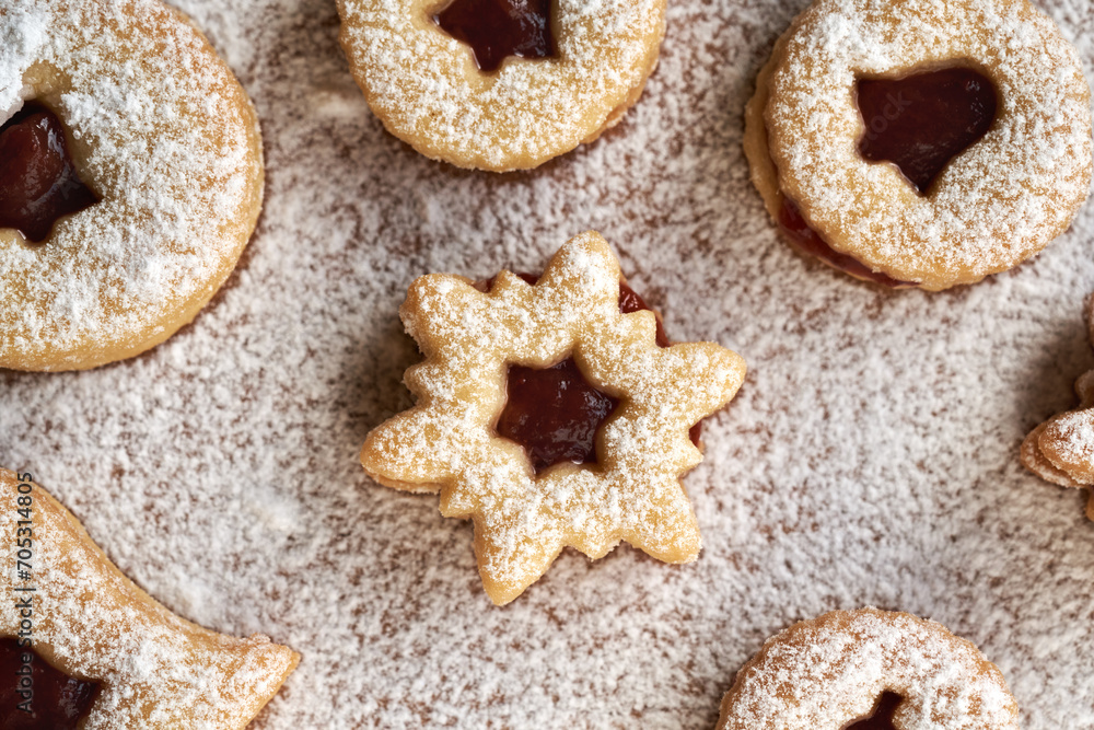 Traditonal Linzer Christmas cookies filled with marmalade and dusted with sugar
