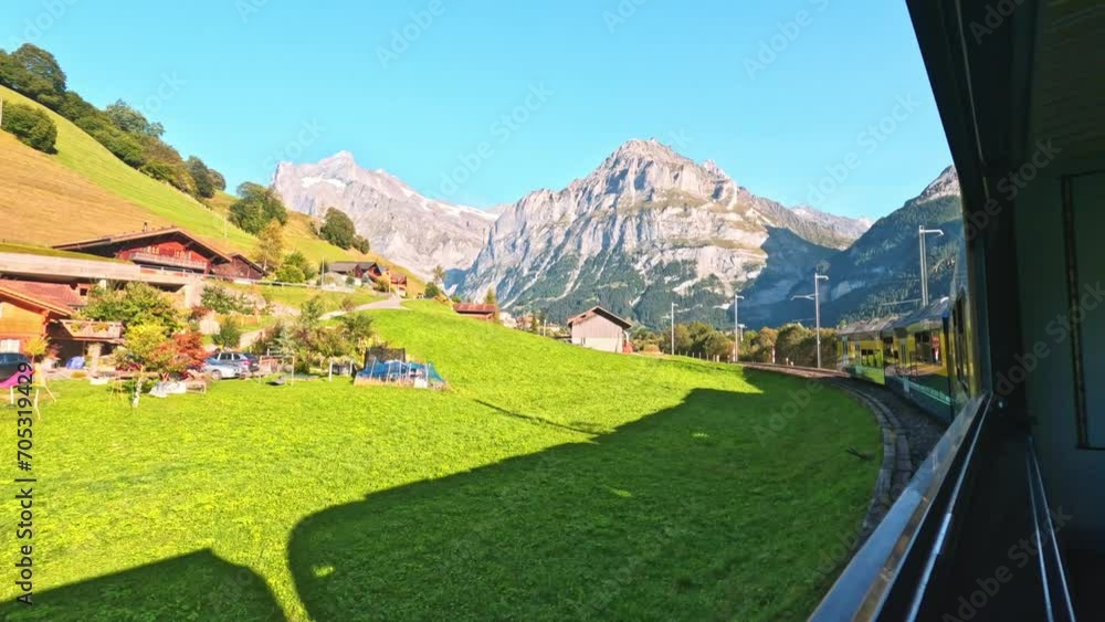 beautiful scenery of switzerland grindelwald from a train inbound to grindelwald. train journey