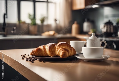 Croissant and coffee on kitchen countertop against blurred interior stock photoKitchen Table Kitchen Counter Food Coffee photo